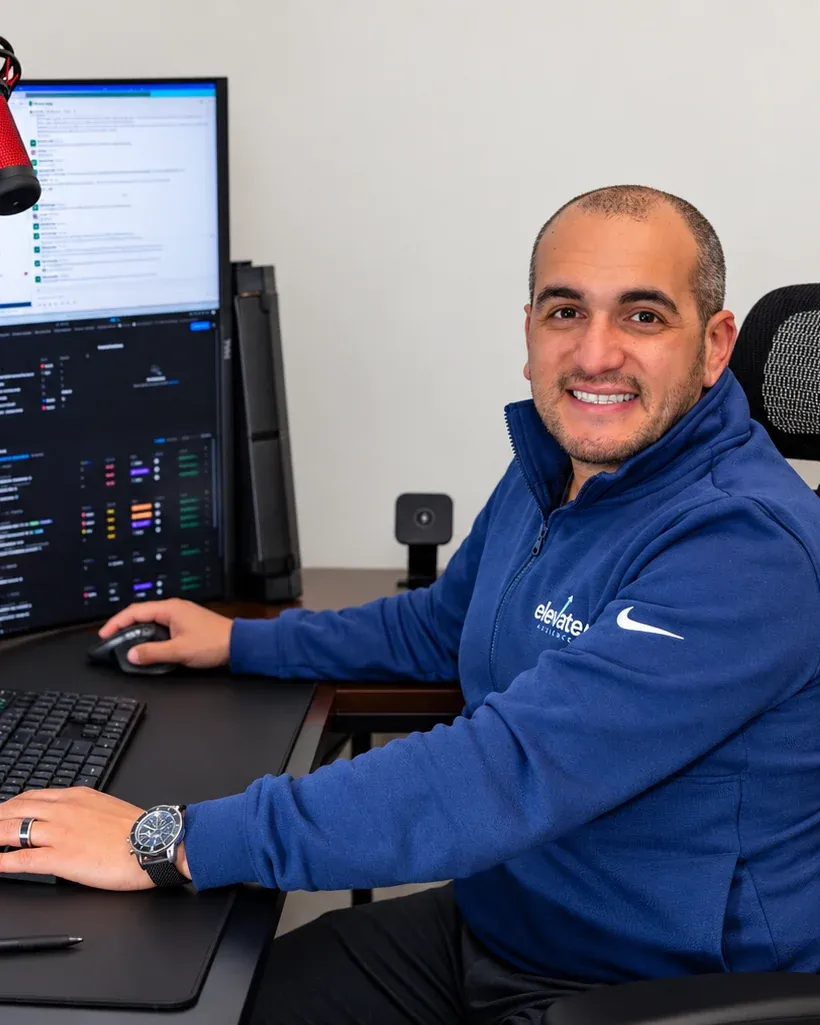 Jared Tangir, founder of Elevated Audience, at his office desk