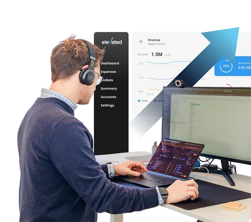 An Elevated Audience strategist on a call, with a client revenue dashboard rising behind him