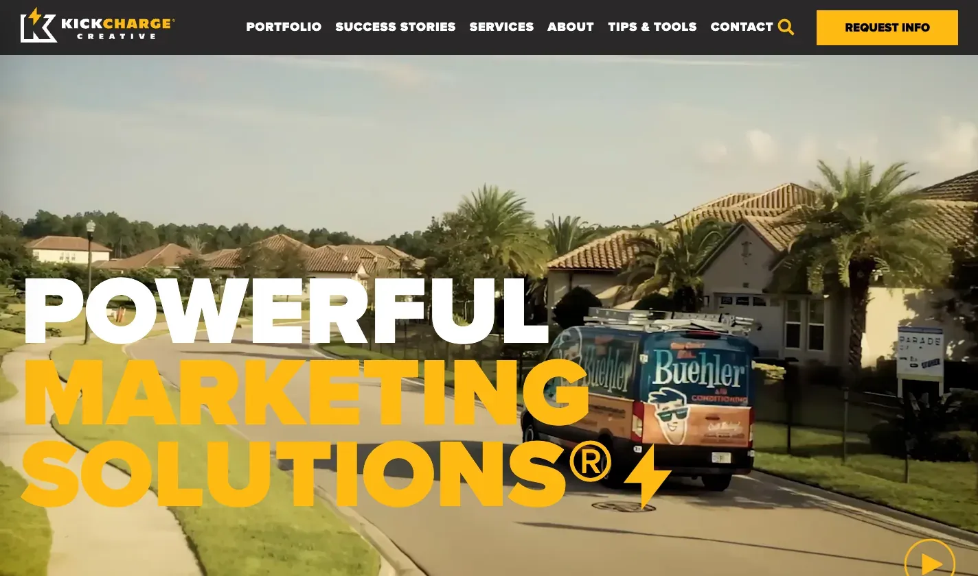 KickCharge Creative homepage hero reading “Powerful Marketing Solutions” over a branded service van.