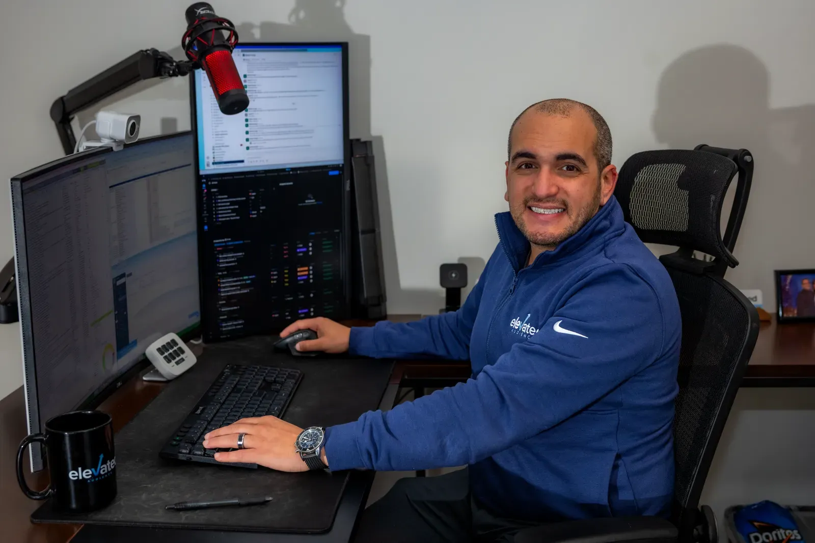 Jared Tangir, founder of Elevated Audience, at the podcast desk