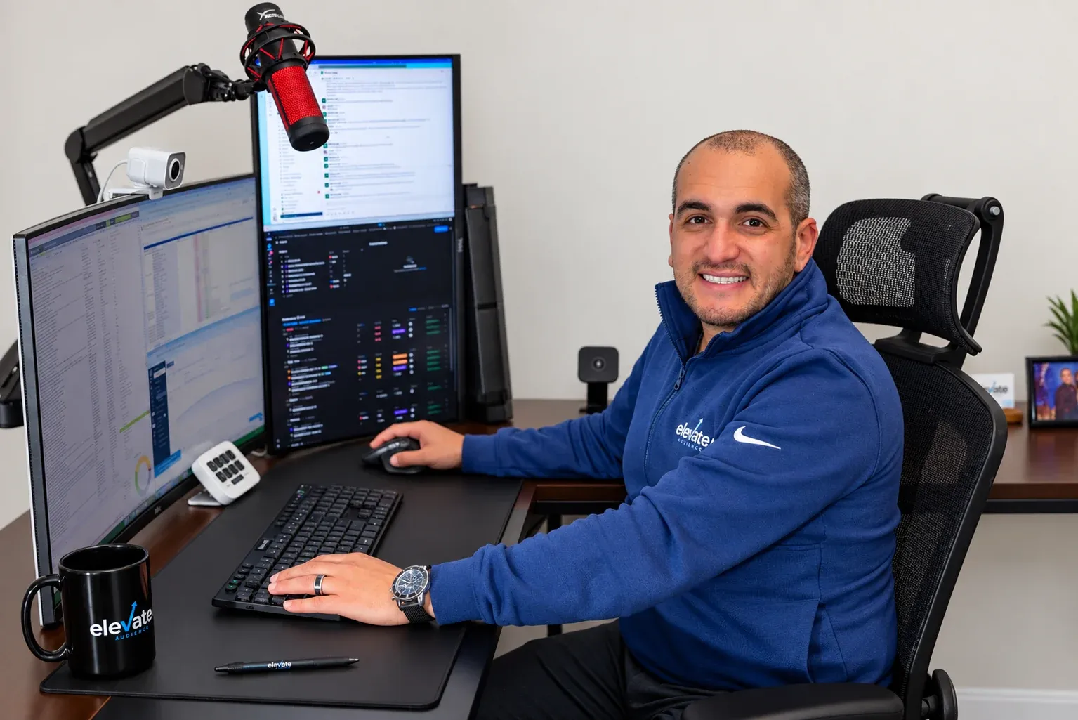 Jared Tangir, founder of Elevated Audience, at the podcast desk